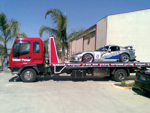 Towing a clipper on our state-of-the-art tilt truck