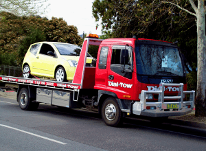 Towing a mini vehicle on one of our tow trucks
