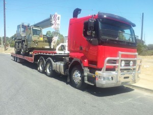Crane transport using one of our low-bed trailer tow trucks