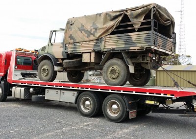 Dial-a-Tow assisting Australian army with towing of army truck using a tilt truck from its fleet