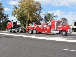 Towing a trailer interstate on Dial-a-Tow's tilt trucks