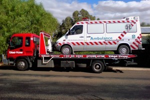 Attending to an emergency ambulance breakdown, towing it to a service depot locally